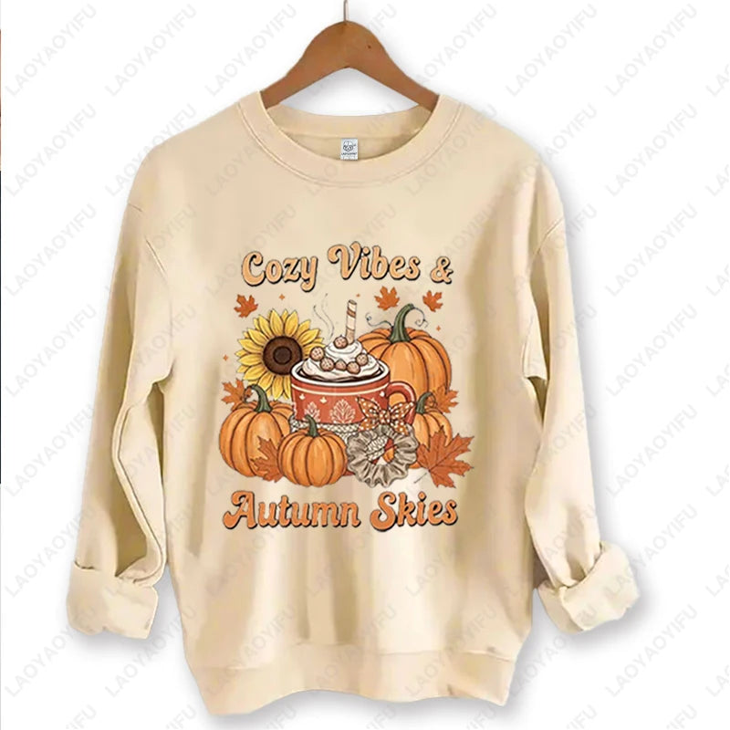 Cozy Vibes & Autumn Skies cream crewneck on a hanger