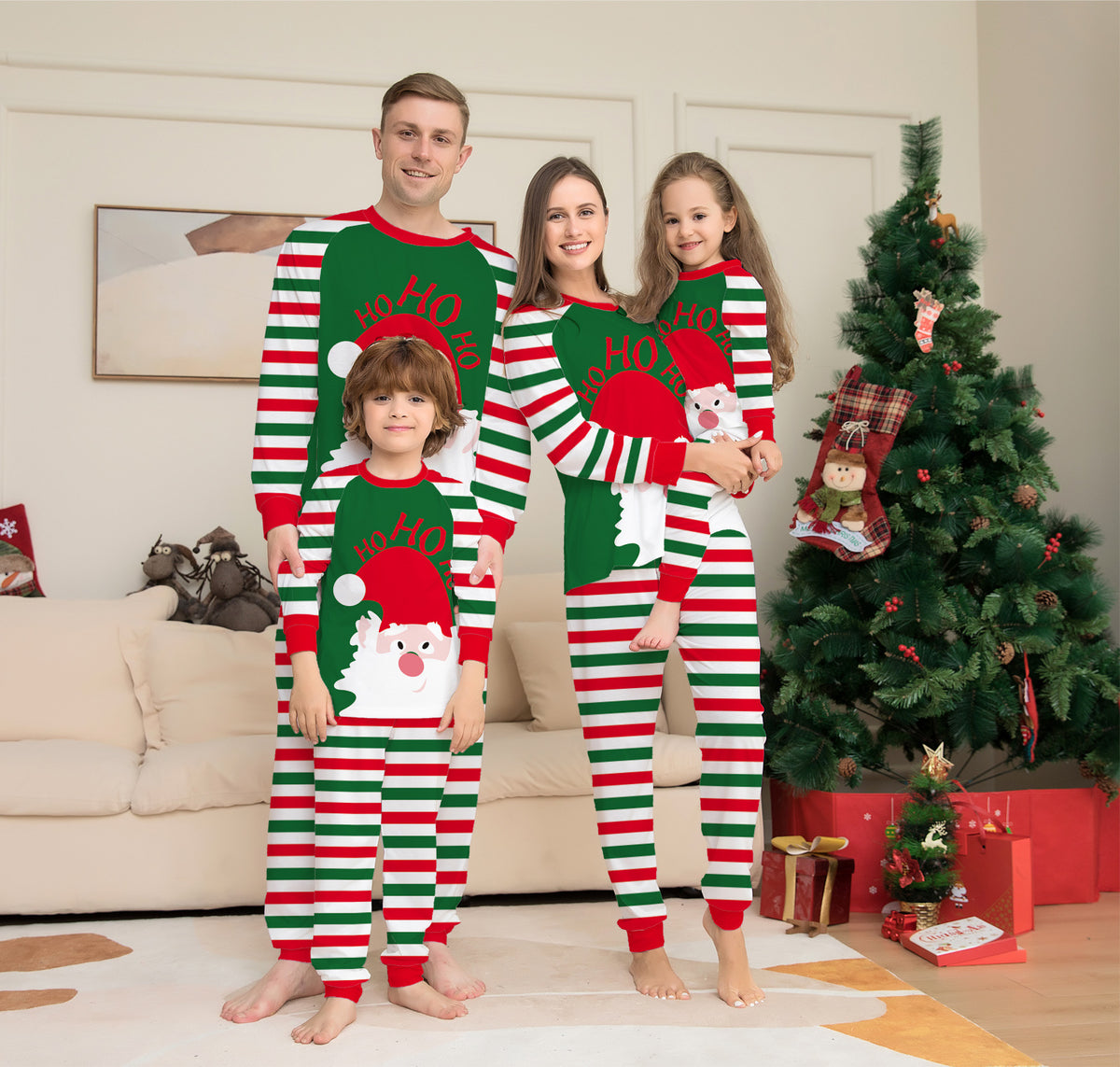 Family in matching Red Stripe Santa Christmas pajamas
